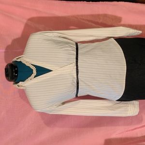 NECESSARY OBJECTS. FITTED PINSTRIPE BLOUSE.